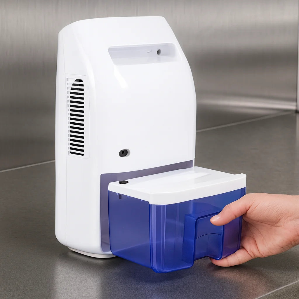 Hand opening a blue container attached to a white electronic device on a metallic surface.