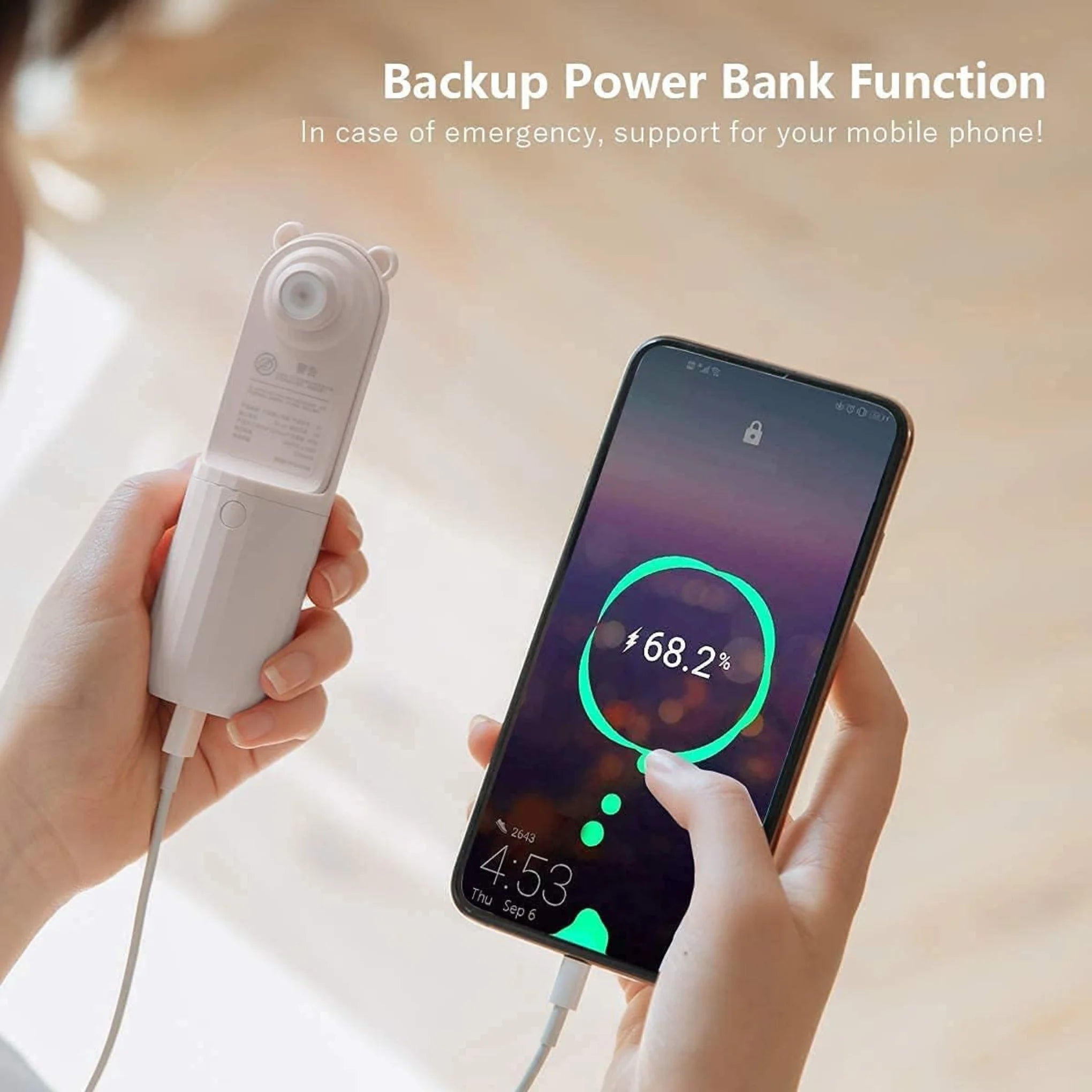 White pocket fan is being used as a power bank and is charging an I-Phone which is showing that it is charging