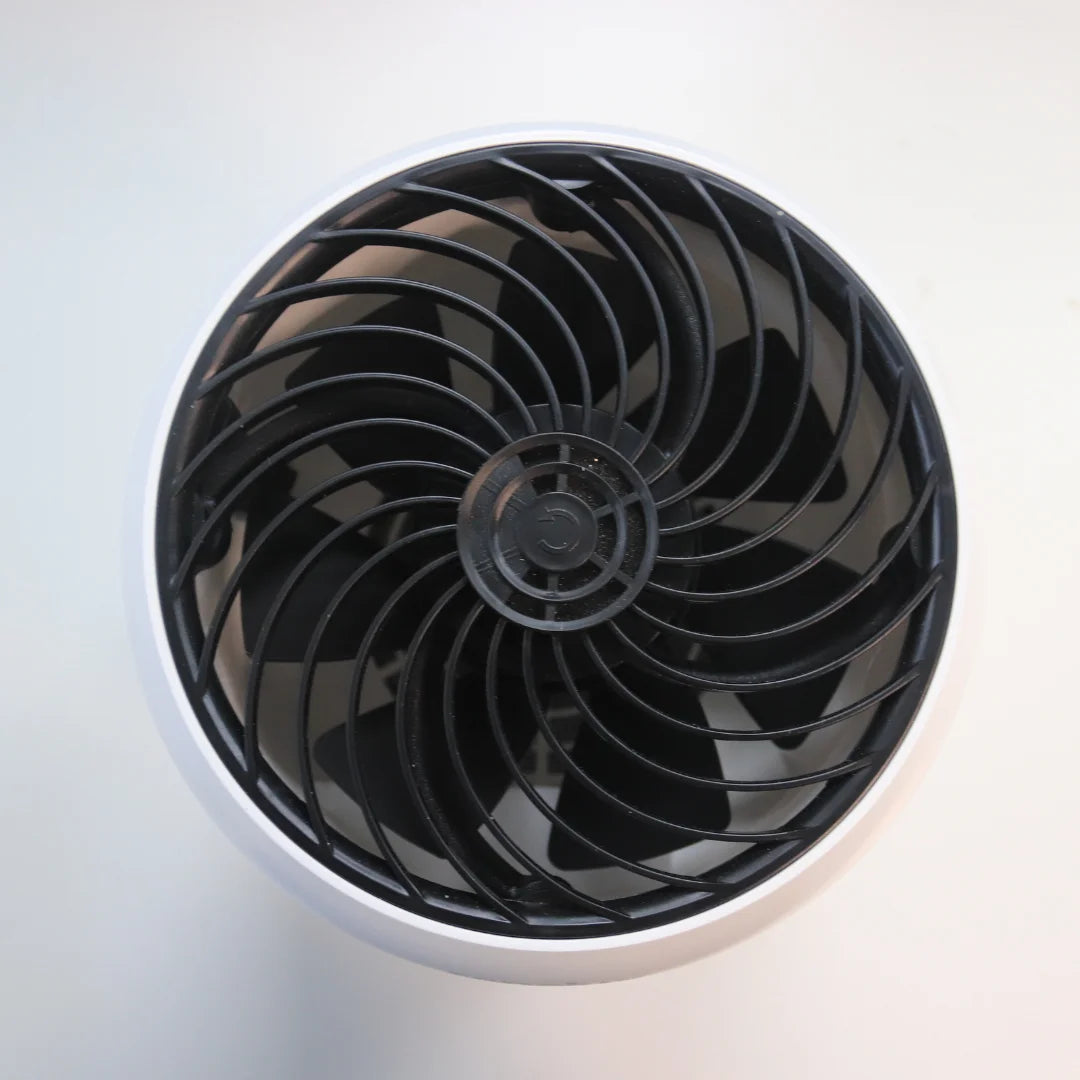 A photo of the Senelux Demi Air Purifier from the top down. A clean, black plastic extraction fan in the centre of the image.