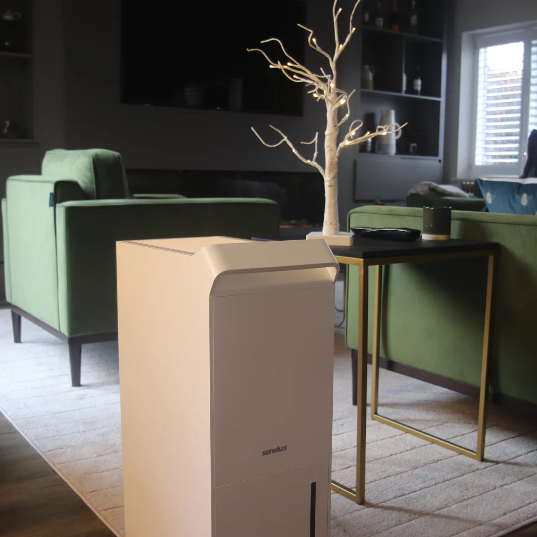 A picture of the Senelux 25l/day dehumidifier in a home environment, removing excess moisture from a home