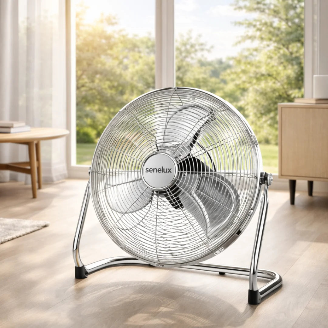 a chrome floor fan with senelux branding in a living room during the summer